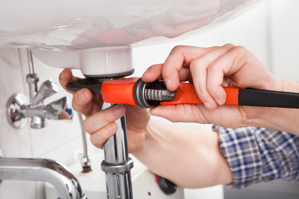 Plumber fixing a drain